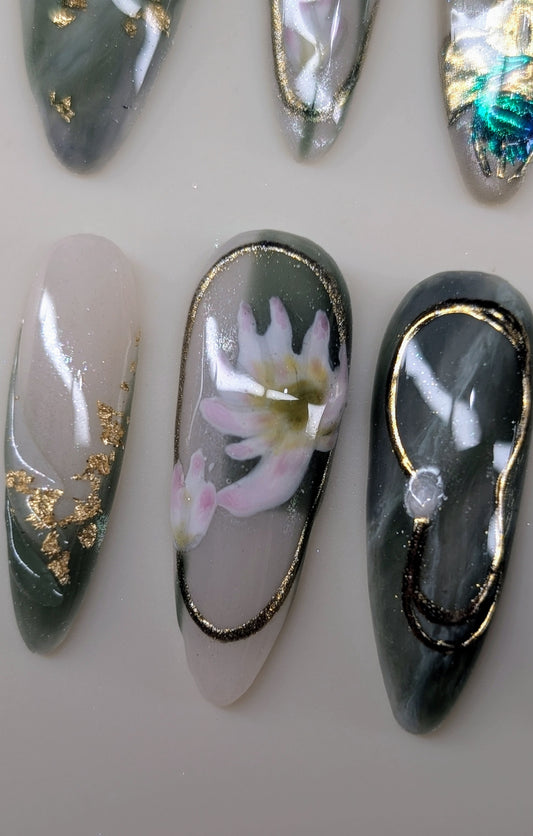 imperial dragon design in jade variant. marbled green and white veins, hand painted dragon elements, 3d lotus flowers, and gold chrome paired with pearls complete this timeless look