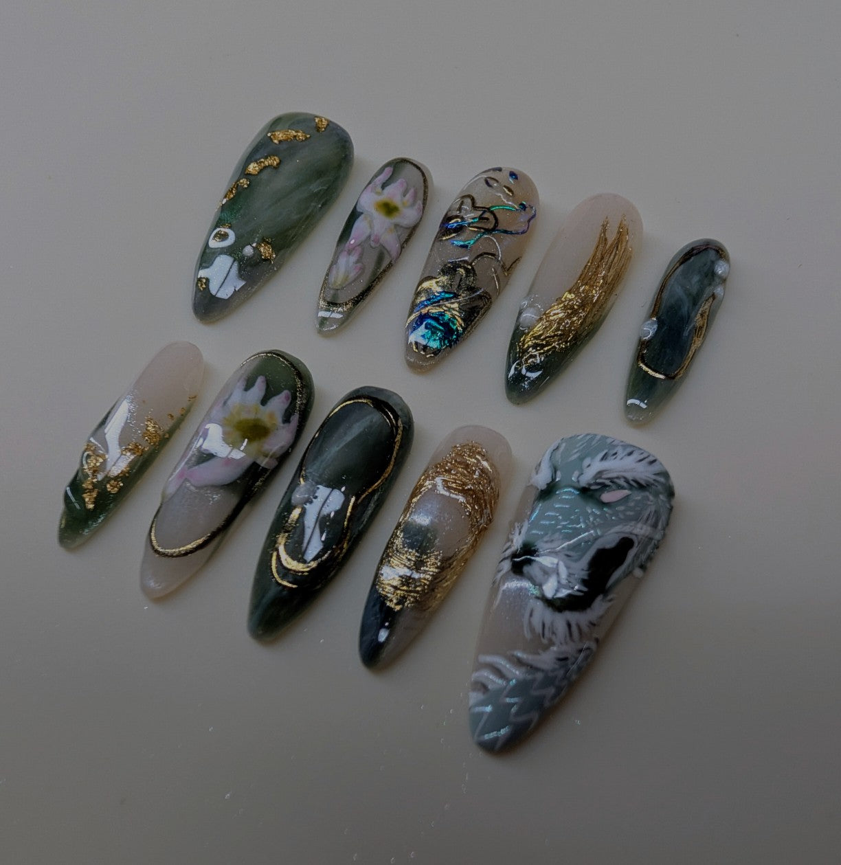 imperial dragon design in jade variant. marbled green and white veins, hand painted dragon elements, 3d lotus flowers, and gold chrome paired with pearls complete this timeless look