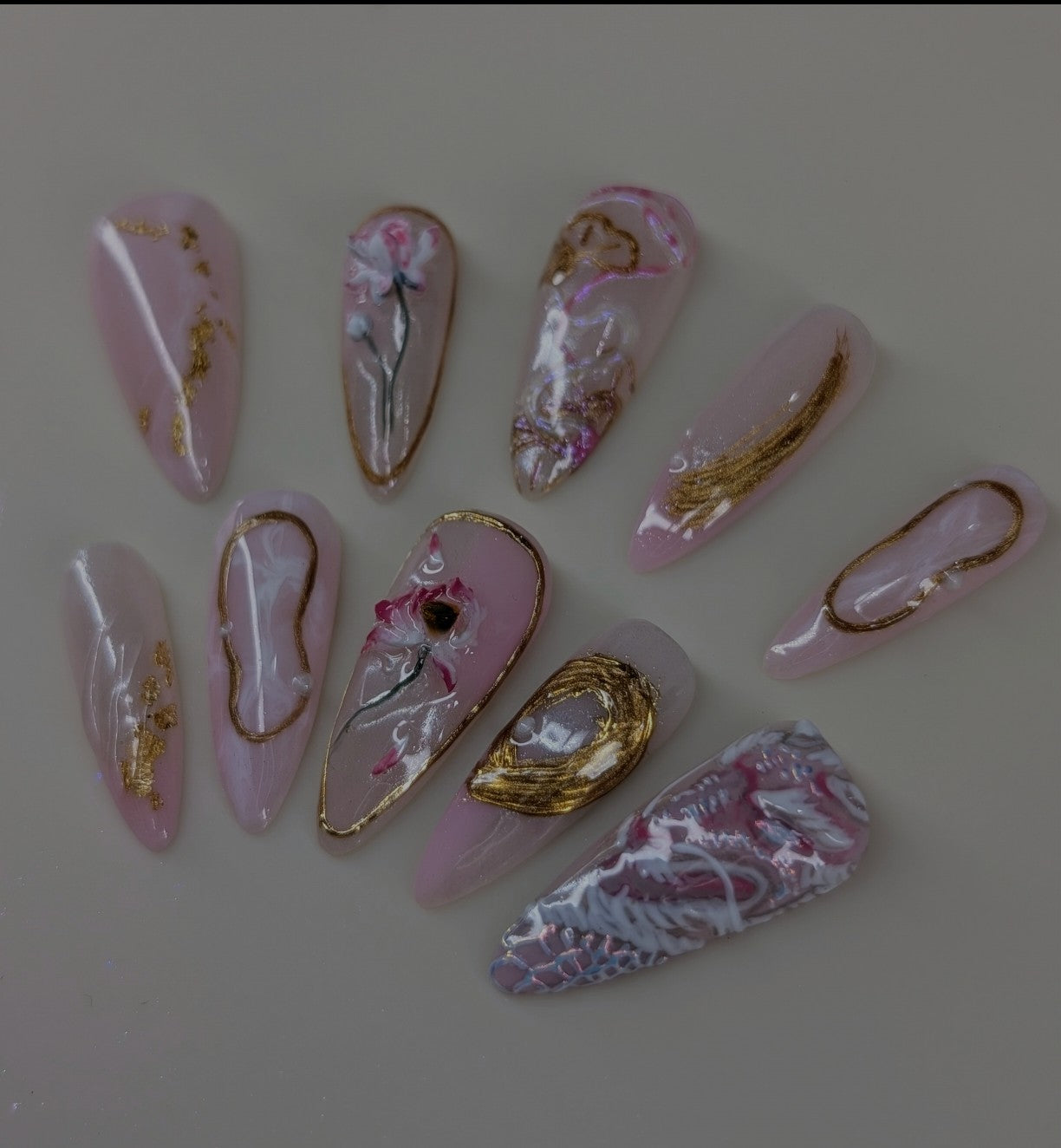 imperial dragon design in rose quartz variant. marbled pink and white veins, hand painted dragon elements, 3d lotus flowers, and gold chrome paired with pearls complete this timeless look
