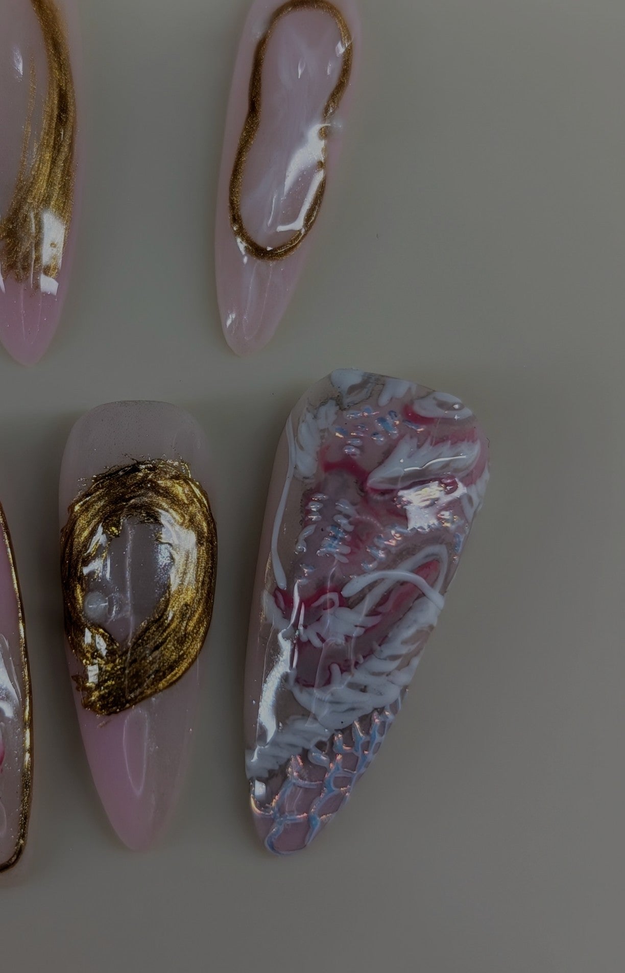 imperial dragon design in rose quartz variant. marbled pink and white veins, hand painted dragon elements, 3d lotus flowers, and gold chrome paired with pearls complete this timeless look