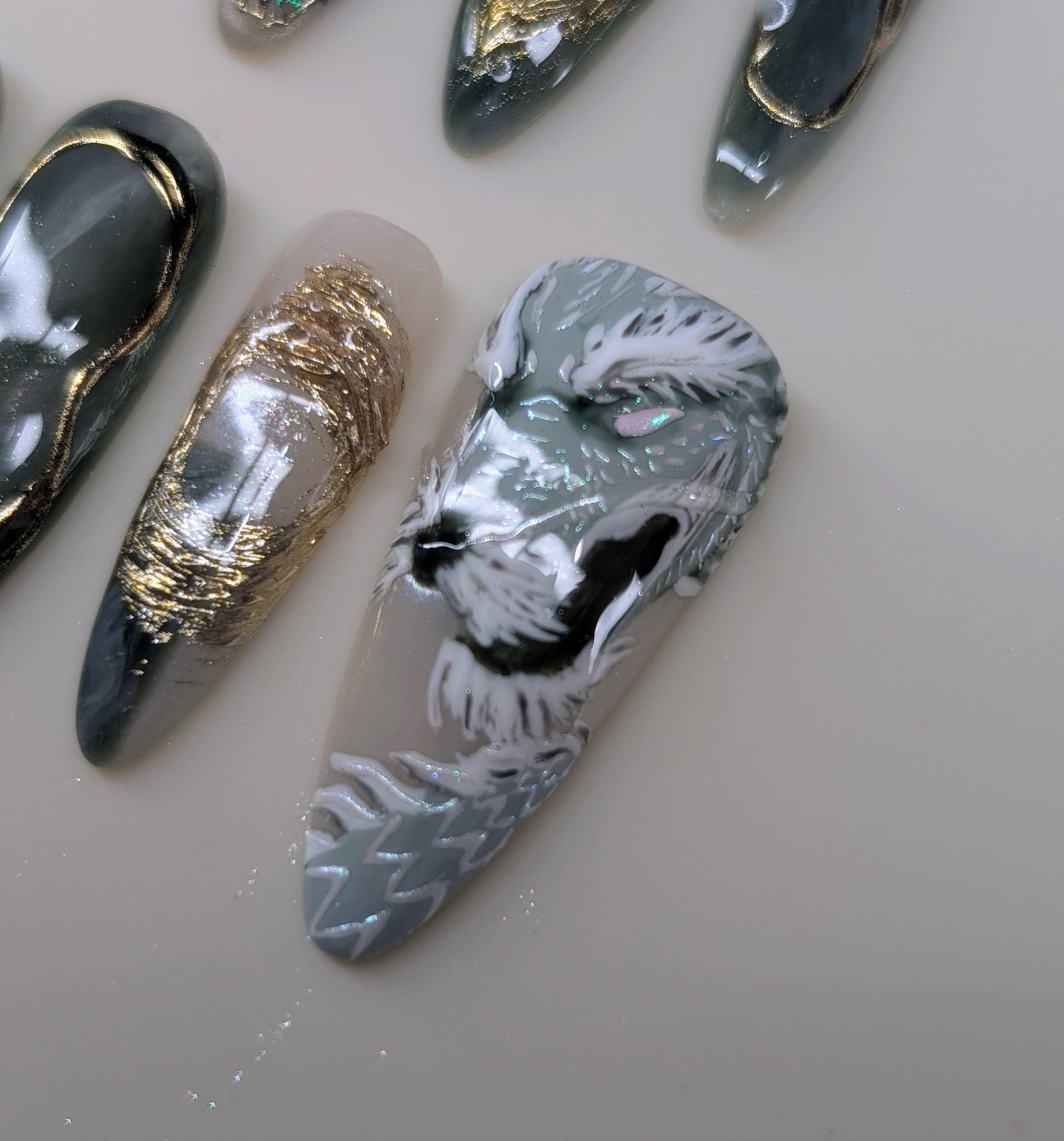 imperial dragon design in jade variant. marbled green and white veins, hand painted dragon elements, 3d lotus flowers, and gold chrome paired with pearls complete this timeless look