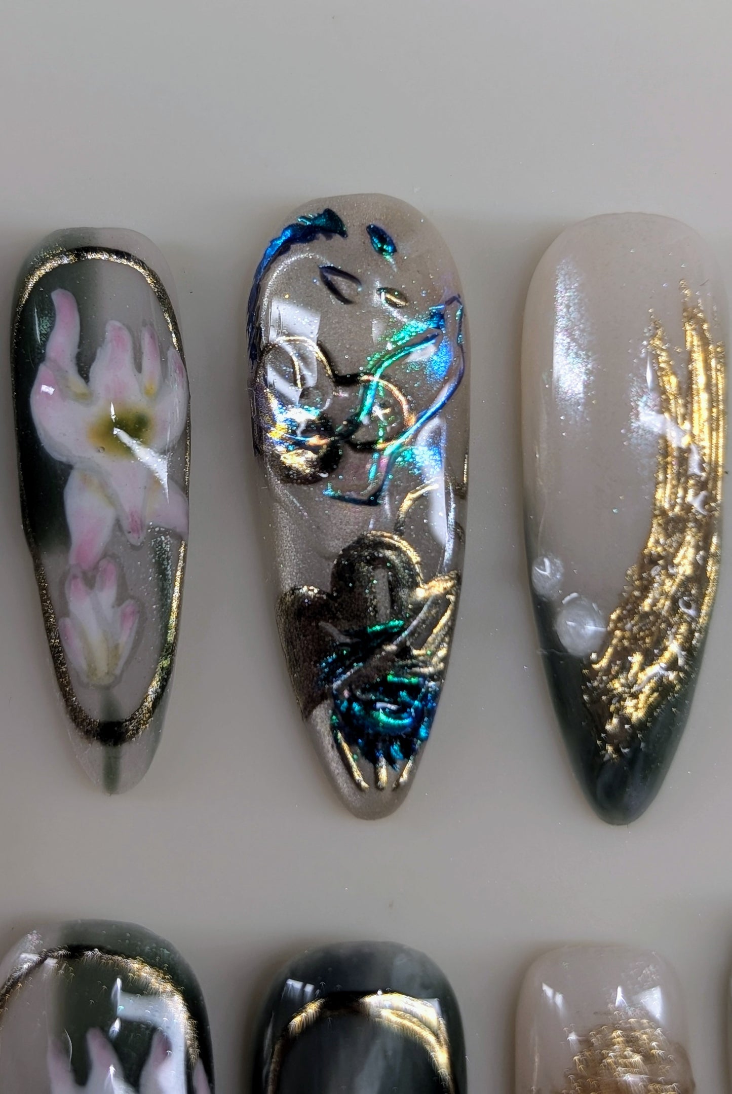 imperial dragon design in jade variant. marbled green and white veins, hand painted dragon elements, 3d lotus flowers, and gold chrome paired with pearls complete this timeless look