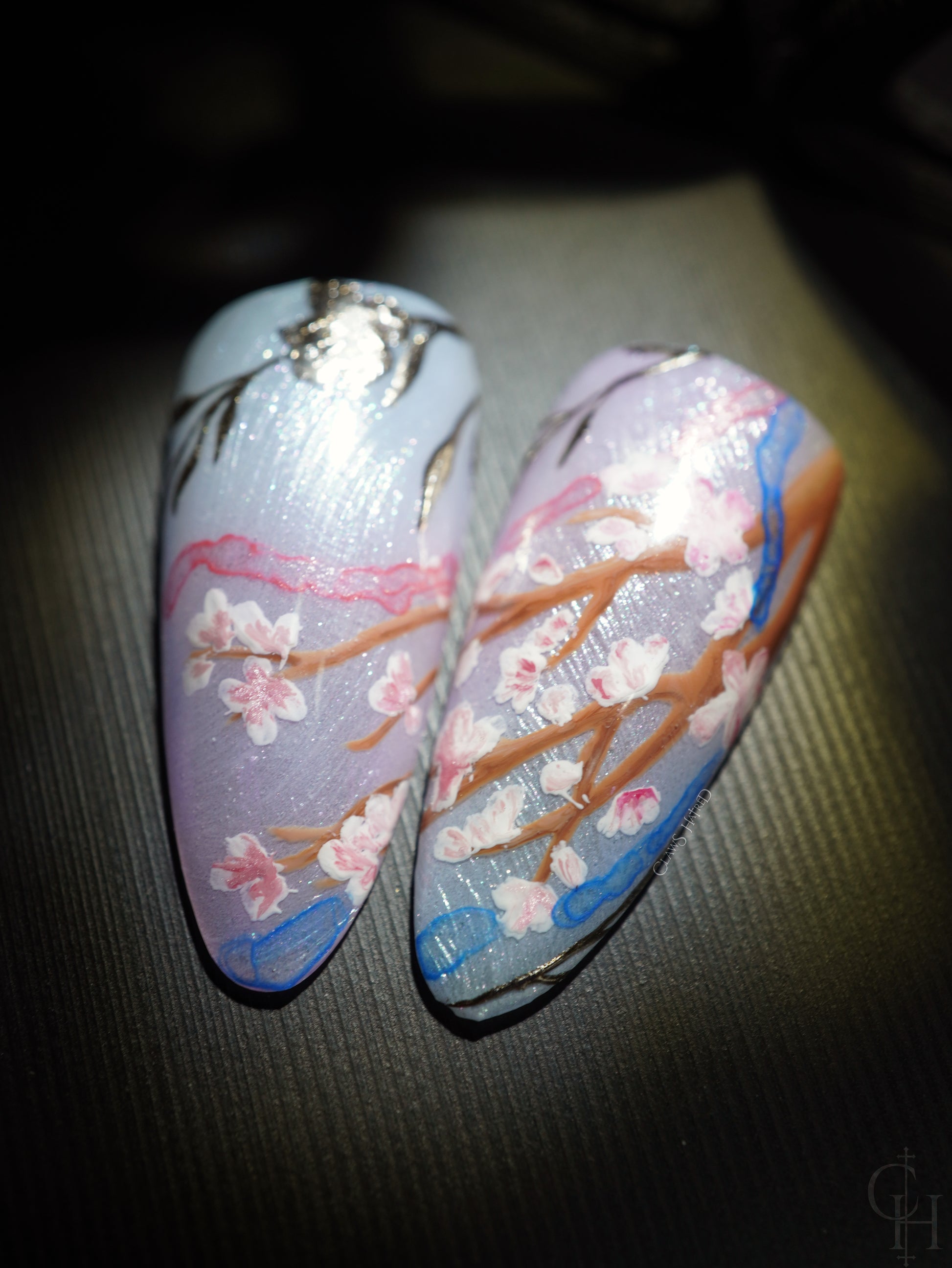 lunar new year love and deepspace set inspired by the key art for the event. pearl textured bases with semi-transparent jelly shades ranging from blue to pink to green and milky white. handpainted landscapes seen through chinese architectural-inspired frames, and apple blossoms on the thumbs. 